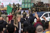 People cheer as Israeli hostage Omer Shem Tov waves upon his release in Nuseirat in the central Gaza