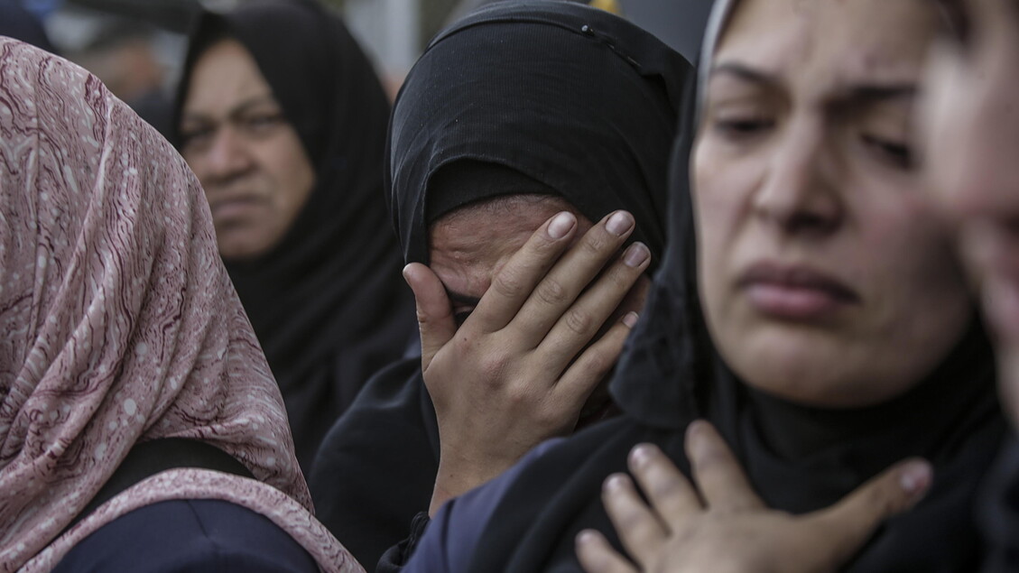 Palestinians mourn their dead at Deir Al Balah hospital after Israeli airstrike in central Gaza