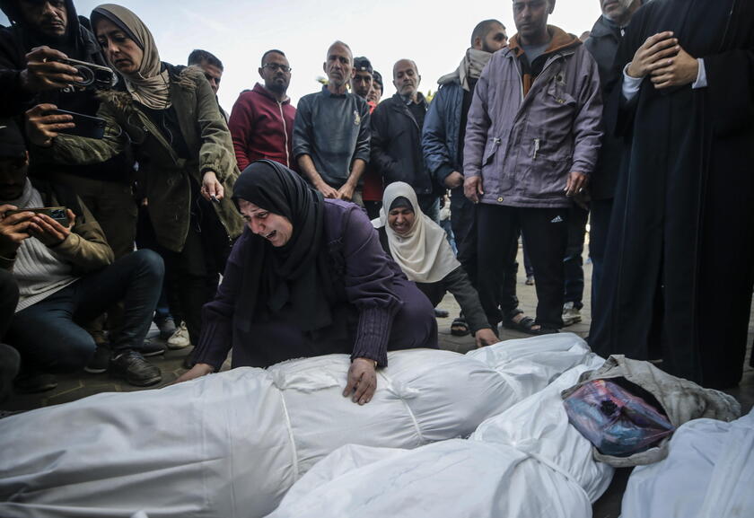 Palestinians mourn their dead at Deir Al Balah hospital after Israeli airstrike in central Gaza