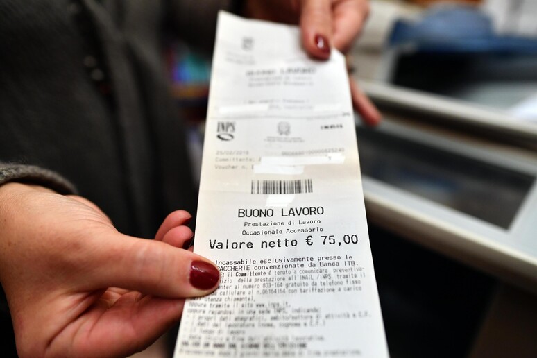 Un 'immagine di un voucher in una foto d 'archivio - RIPRODUZIONE RISERVATA